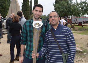 Yaki Marcus (left) and Yossi Cohen (right) hold their Maccabiah torch. 