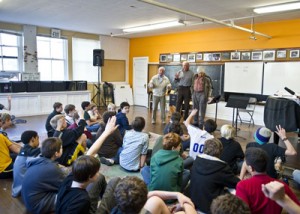 The Northwest Boychoir of Seattle listen to a presentation from three Terezin survivors.