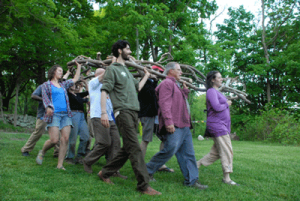 Participants in Art Kibbutz carry the 'Shema: Listen' wooden sculpture.  Photograph by Paul R. Solomon.