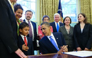 The Pearl family with President Obama at the Freedom of the Press Act’s signing. Official White House Photo by Pete Souza.