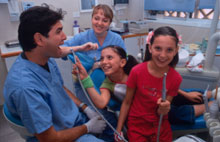 Open Wide Dr. Alon Seidman (left) and dental assistant Ella Jarzki try to make oral hygiene fun for their young patients in the new clinic in Sderot. 