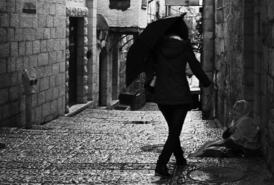 Beggar in Jerusalem Old City. Photo by Jerusalemgifts. Wikimedia Commons.
