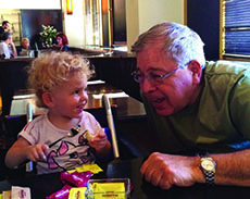 Richard Lakin with one of his eight grandchildren.