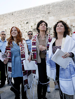 Labour parliament member Stav Shaffir (2L), left-wing Meretz parliament members Tamar Zandberg (C) and Michal Rozin wear prayer shawls as they dance and pray at the Western Wall, Judaism's holiest site, in Jerusalem on March 12, 2013. "Women of the Wall" fights for the right for Jewish women to conduct prayer services, read from a Torah scroll while wearing prayer shawls, and sing out loud at the women’s section of the Western Wall. Photo by Miriam Alster/FLASH90