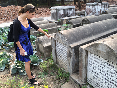 Shoshana pays respects to Flora, her great-grandmother and namesake.